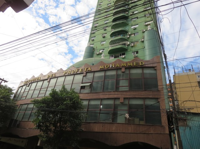 a mosque, apartment building, food court, and barber shop all in one!